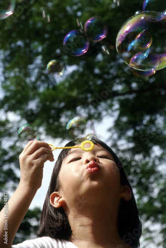 Girl blowing bubbles