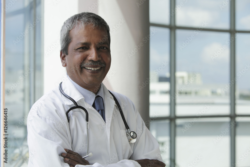Head shot of Indian doctor smiling