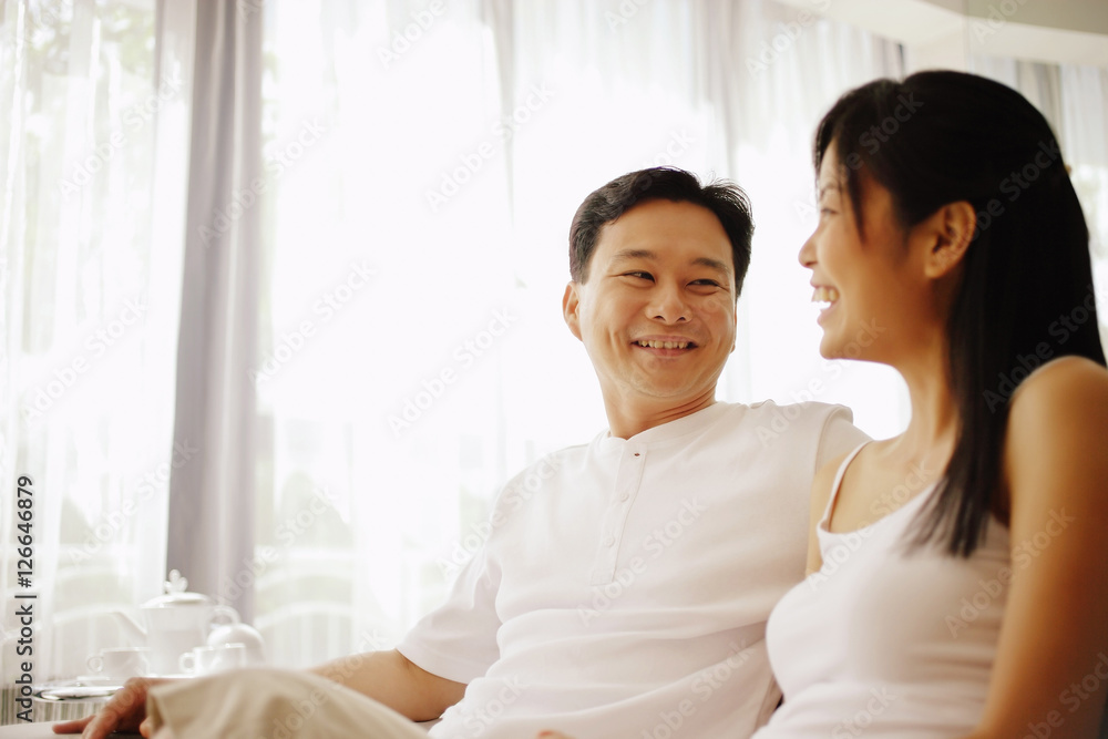 Couple sitting down side by side, talking Couple sitting down side by side, talking