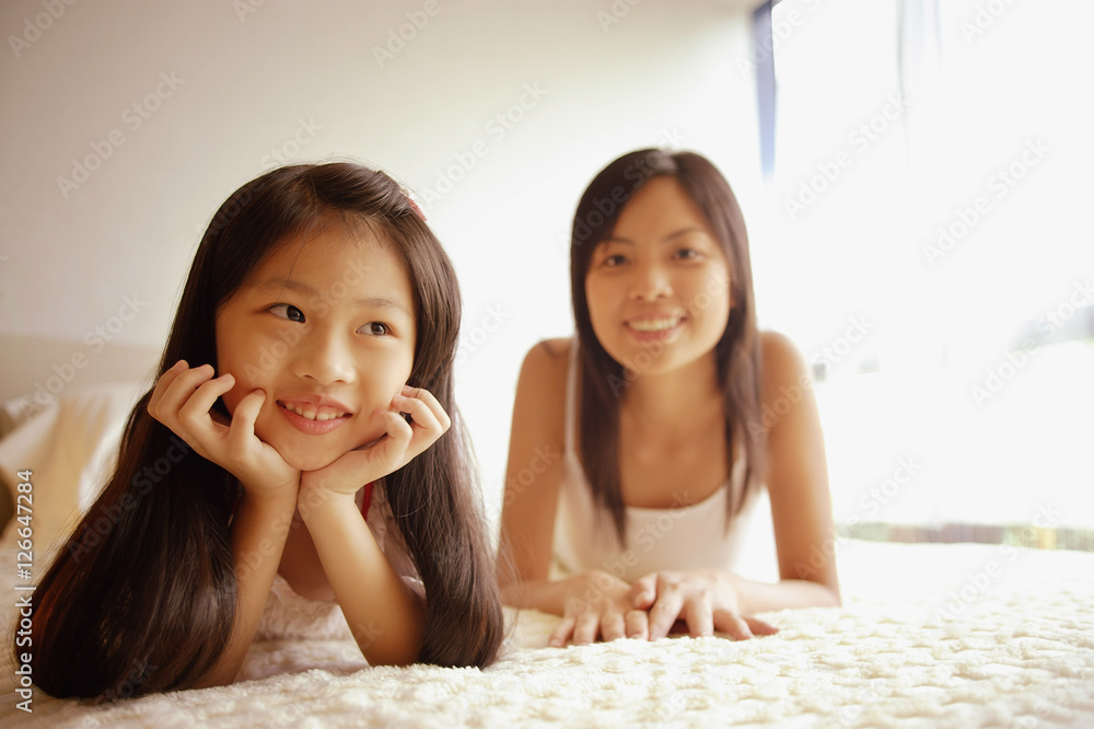 Mother and daughter, looking on front, looking at camera Mother and daughter, looking on front, looking at camera