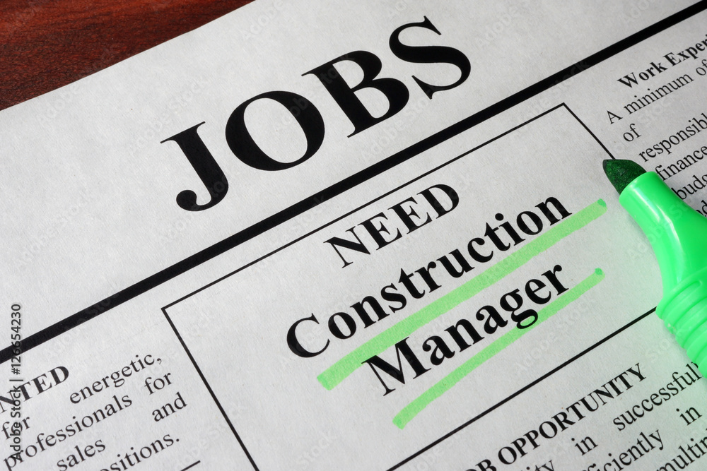 Newspaper with ads for vacancy Construction Manager. Employment concept. Newspaper with ads for vacancy Construction Manager. Employment concept.
