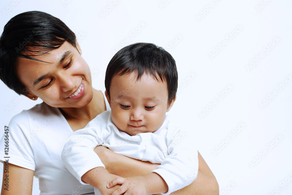 Mother with baby boy, looking down, portrait Mother with baby boy, looking down, portrait