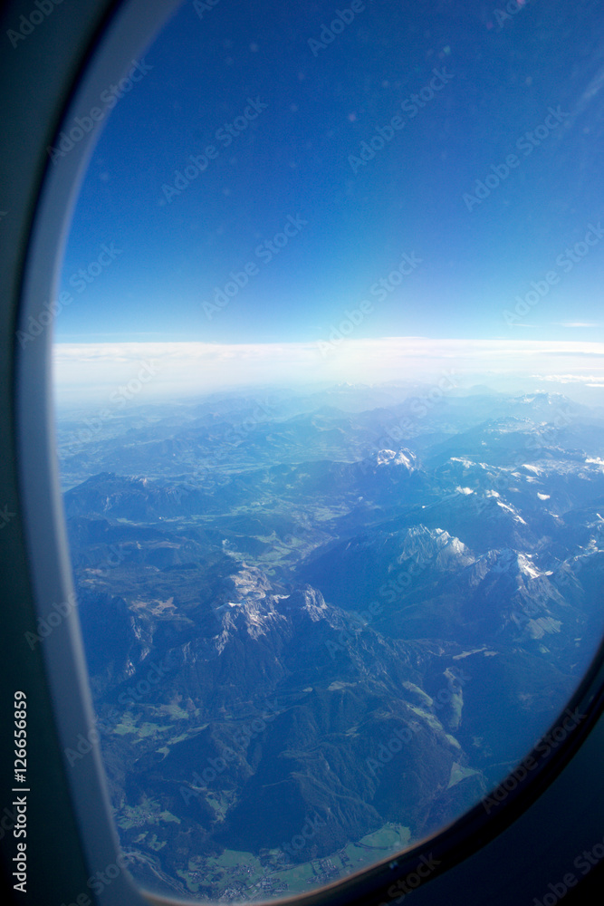 AUSTRIA - October 2016: The alps as seen from an airplane, plane view of mountains. AUSTRIA - October 2016: The alps as seen from an airplane, plane view of mountains.