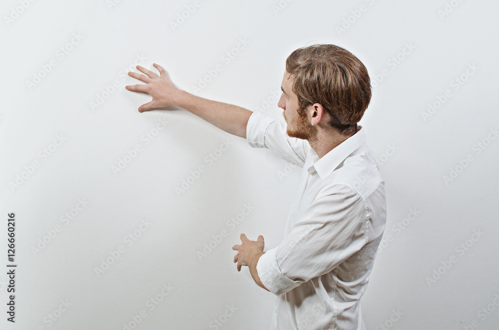 Young Adult Male in White Shirt Gesturing, Showing, Teaching Young Adult Male in White Shirt Gesturing, Showing, Teaching