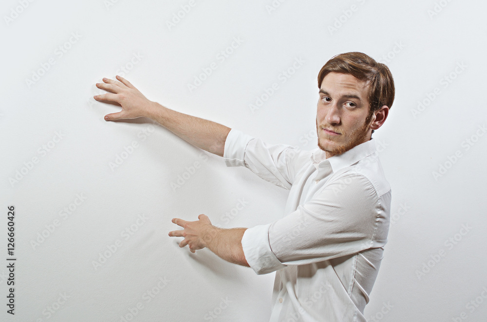 Young Adult Male Persenter in White Shirt Gesturing, Showing, Teaching
