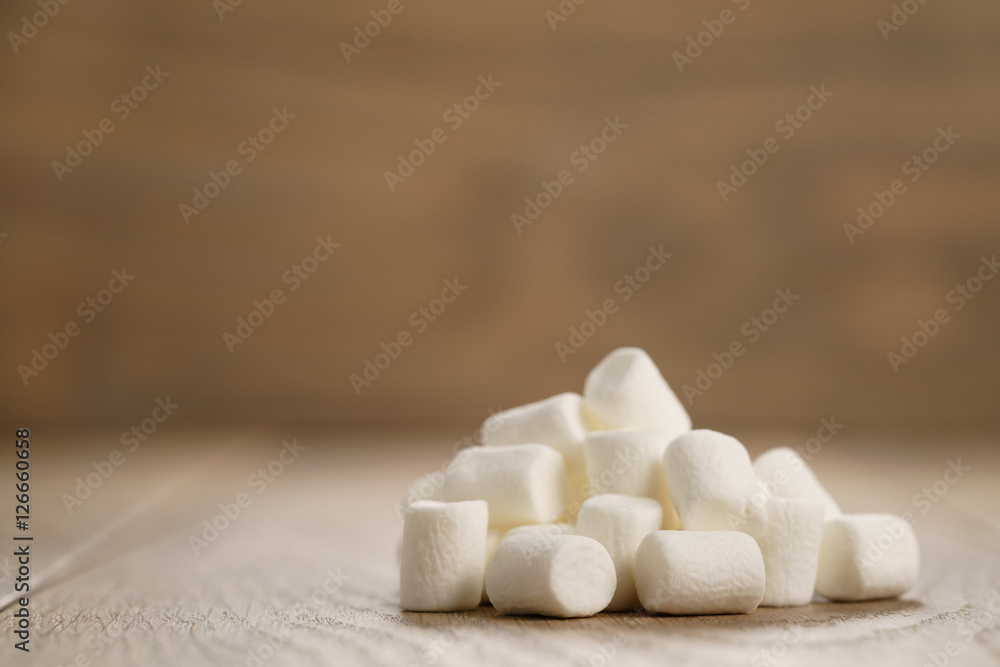 white marshmallows on wooden table white marshmallows on wooden table