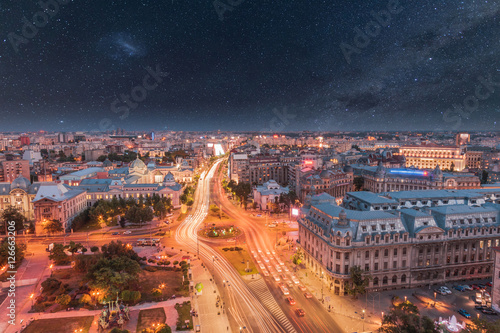 Aerial view of the capital city of Romania  Bucharest. Night sky with stars.