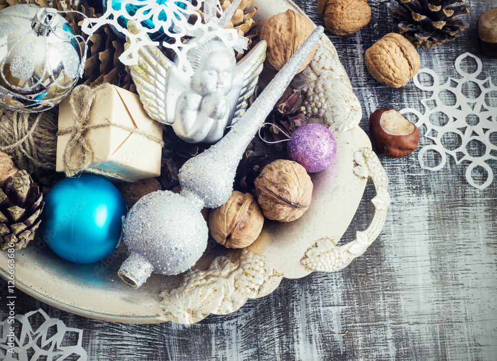 Christmas Composition of balls, cones and snowflakes in a metal bowl. Vintage style. toning Christmas Composition of balls, cones and snowflakes in a metal bowl. Vintage style. toning