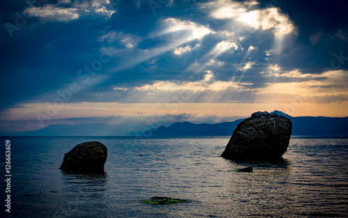 dark stones in sea water