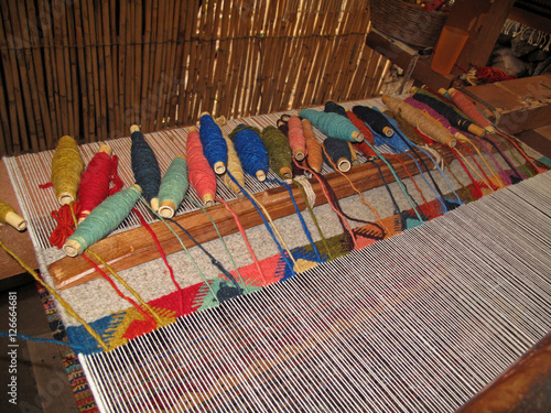 Weaving with an old traditional loom, Teotitlan Del Valle, Mexiko photo