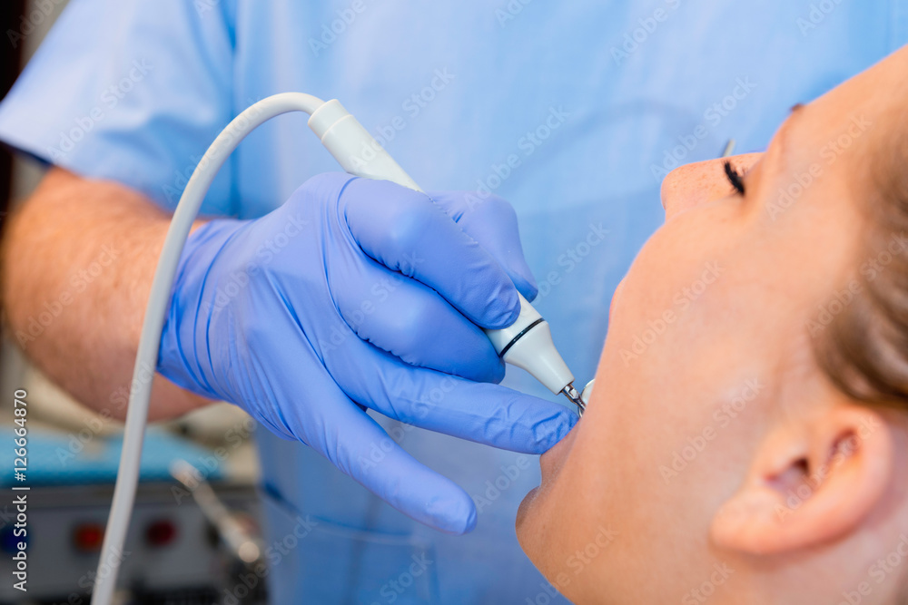 Dentist. Dentist removing tartar Dentist. Dentist removing tartar