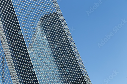 Skyscrapers with glass facade. Modern buildings in Paris business district. Concepts of economics, financial, future. Copy space for text. Dynamic composition. Toned