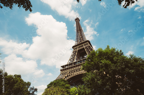 Eiffel Tower. Paris. France. Famous historical landmark on the quay of a river Seine. Romantic  tourist  architecture symbol. Toned