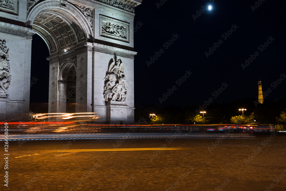 Fototapeta premium Triumphal arch. Paris. France. View of Place Charles de Gaulle. Famous touristic architecture landmark in summer night. Napoleon victory monument. Symbol of french glory. World historical heritage.