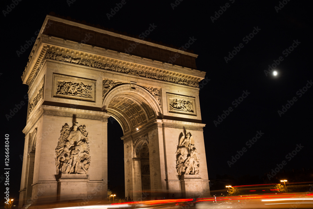 Triumphal arch. Paris. France. View of Place Charles de Gaulle. Famous touristic architecture landmark in summer night. Napoleon victory monument. Symbol of french glory. World historical heritage.