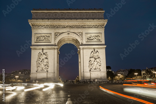 Triumphal arch. Paris. France. View of Place Charles de Gaulle. Famous touristic architecture landmark in summer night. Napoleon victory monument. Symbol of french glory. World historical heritage.