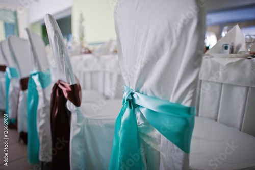 turquoise ribbons on wedding chair