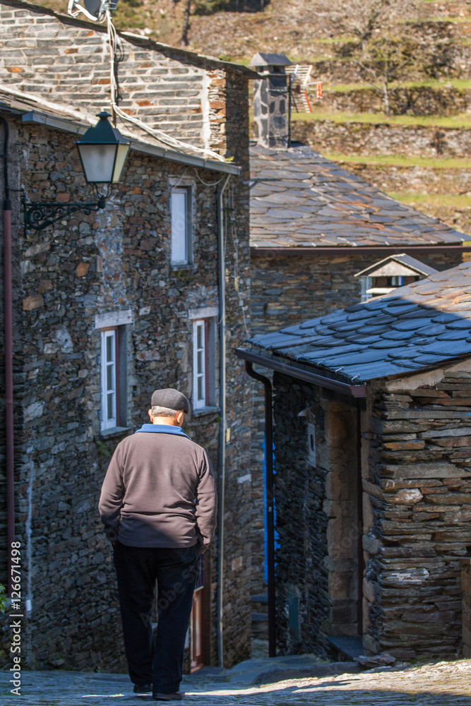 old man walking down the street old man walking down the street