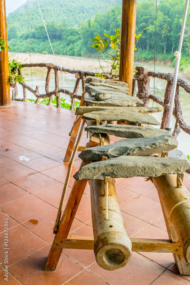 Cafe bench in mountains Truong son and a river near Ca Pass Vietnam