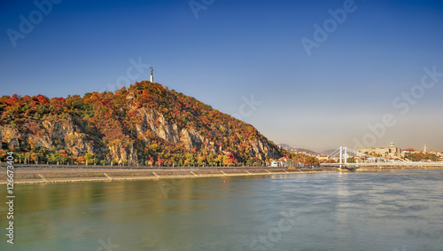 Photography The Gellert Hill (Hungarian: Gellért hegy) and the Elisabeth Bridge  (Hungarian: Erzsébet híd) over the Danube river  in Budapest (Hungarian: Duna) at autumn