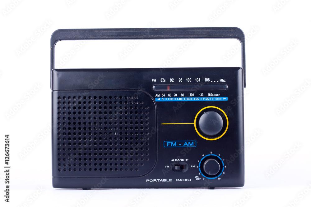 black vintage retro style AM, FM portable radio transistor receiver on white background  isolated 

