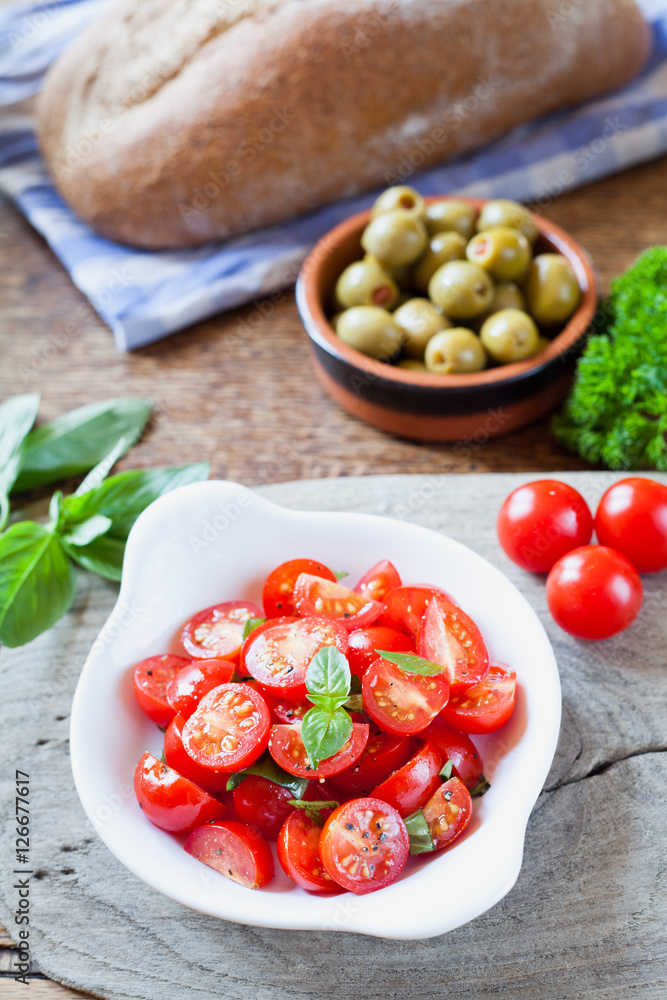 Cherry tomatoes basil salad. Cherry tomatoes basil salad.