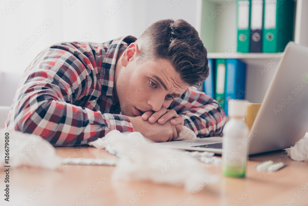 Unhealthy manager with high temperature lying on working table Unhealthy manager with high temperature lying on working table