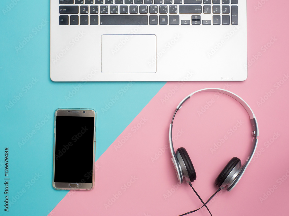 Top view of colorful concept , notebook , headphone on color background for create idea for business or design .Relax coffee time (flat lay) Top view of colorful concept , notebook , headphone on color background for create idea for business or design .Relax coffee time (flat lay)