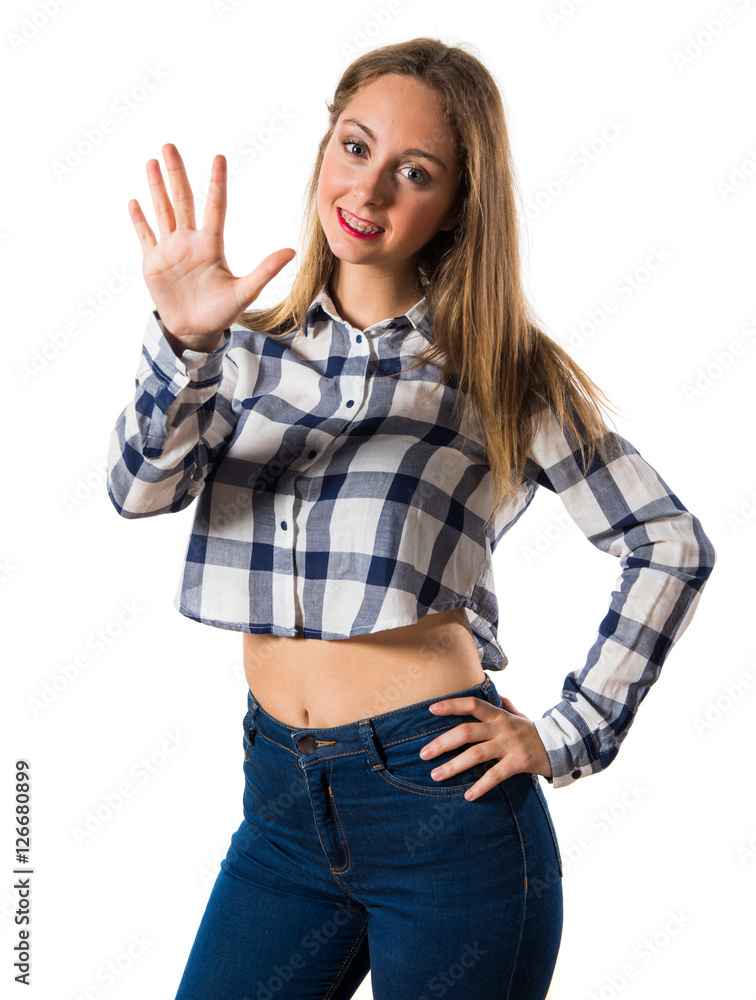 Blonde teen girl counting five Blonde teen girl counting five