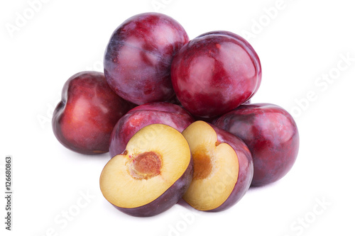 Group of plum fruits and a half  on white background