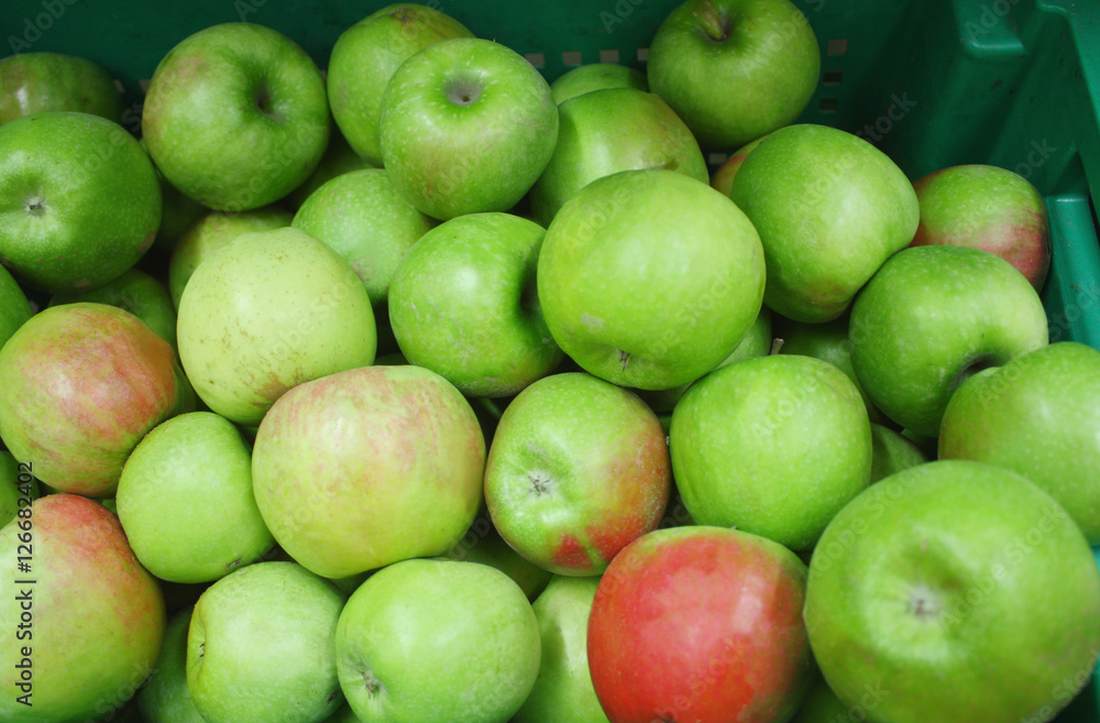 Red and green fresh apples in supermarket, closeup Red and green fresh apples in supermarket, closeup
