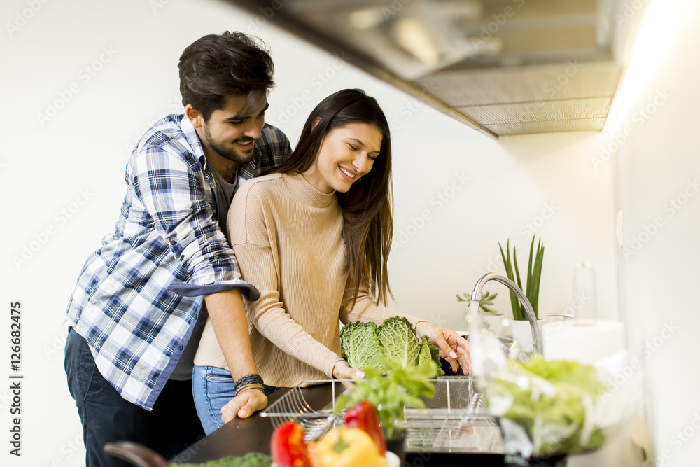 Young couple in the kitchen Young couple in the kitchen