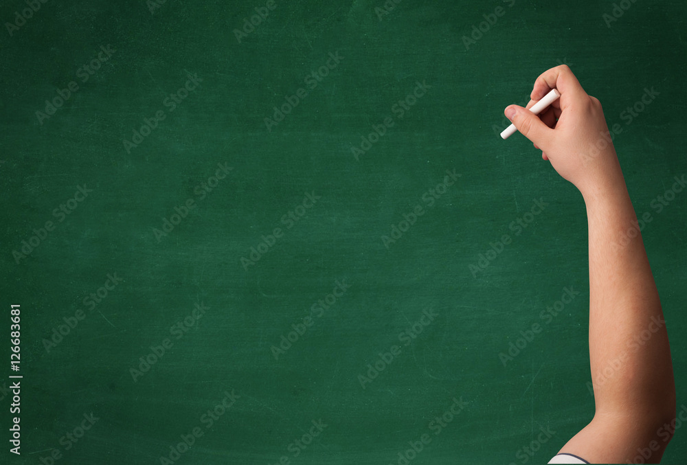 Hand writing on clean blackboard Hand writing on clean blackboard