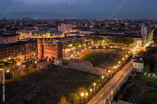 Turin (Torino) night view on Porte Palatine and Porta Palazzo