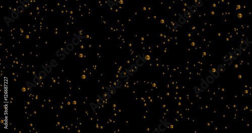 golden bubbles movement inside a glass of champagne on black background