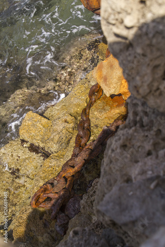 Rustic Chain in Herods Port ruins in Caesarea. Mediterranean coast of Israel