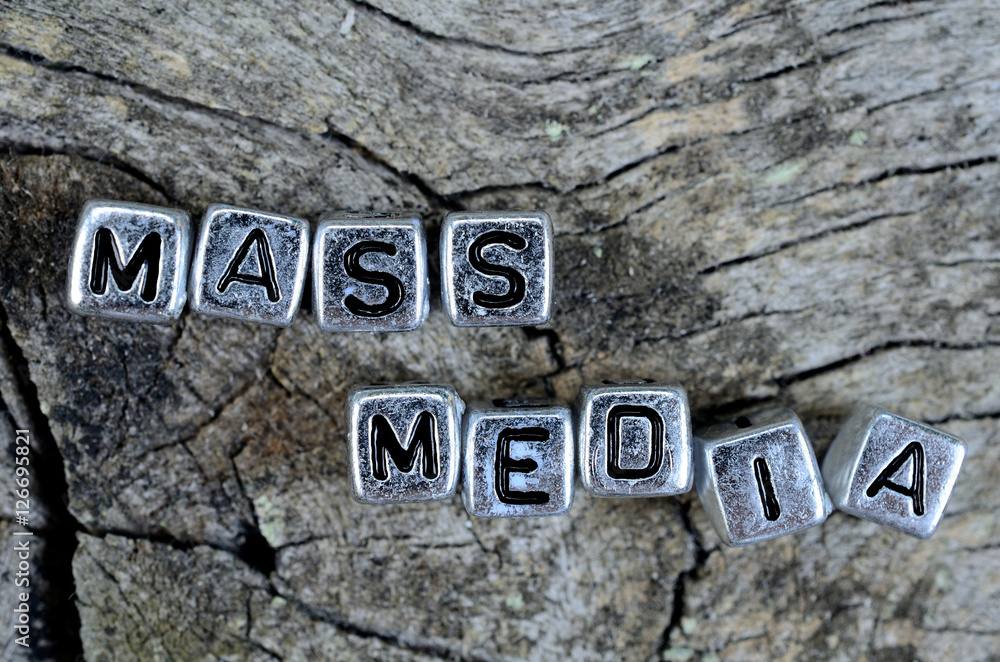 cube word mass media on table cube word mass media on table