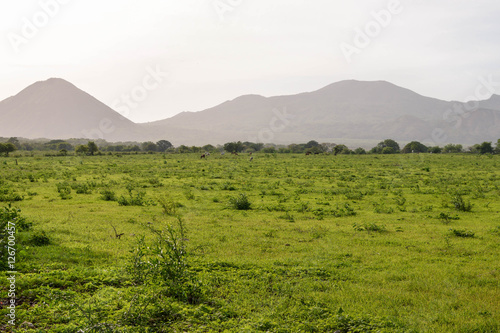 Hazy volcanic landscape of the fields and mountains in the village by Puerto Momotombo in the vicinity of Momotombo volcano, Nicaragua. Central America