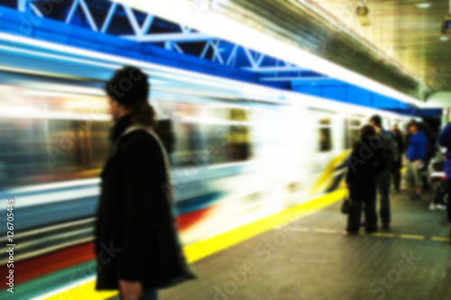 blurred people in subway station
