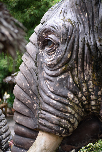 Elephant head sculpture in the garden photo