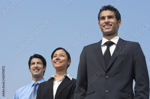 Canvas Print three colleagues standing, smiling