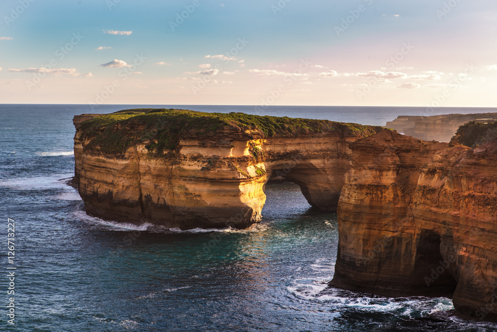 An aerial view of the 12 Apostles, a collection of limestone stacks off the shore of the Port Campbell National Park, by the Great Ocean Road in Victoria, Australia