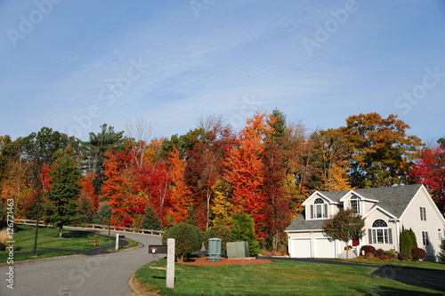 apartment building with colorful autumn trees
