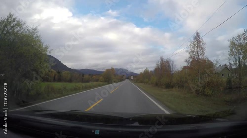 Time-lapse hyperlapse of a car driving Skibotn on the road towards Tromso, in north Norway photo