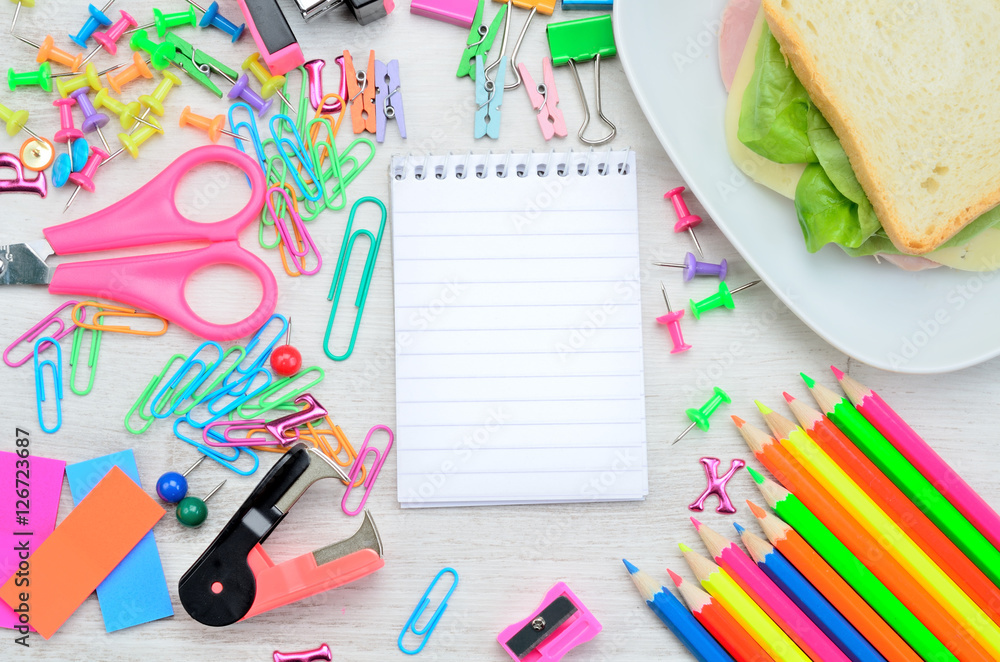 notebook with stuff for school on table notebook with stuff for school on table
