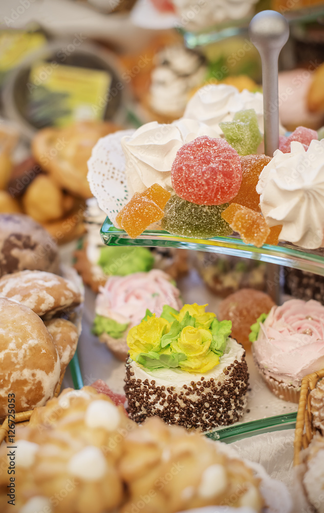 vertical background with fresh sweet baked cakes