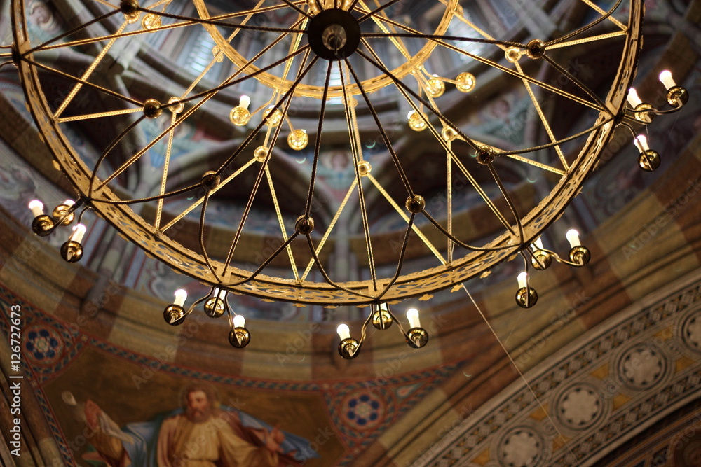 Vintage golden lamp inside the church