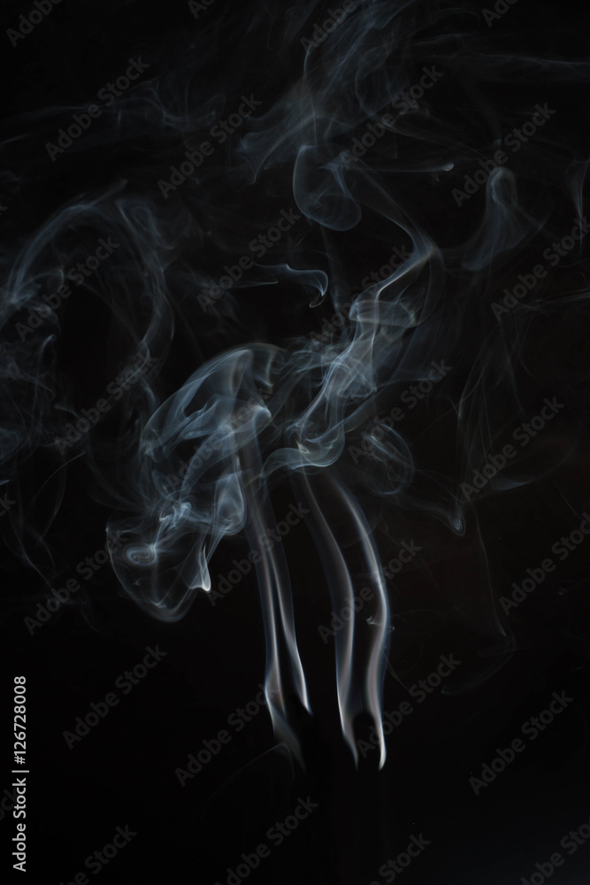 White or gray smoke on dark background. White or gray smoke on dark background.