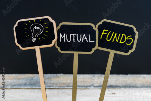 Concept message MUTUAL FUNDS and light bulb as symbol for idea