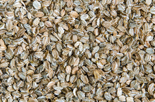 Rye flakes background. Healthy lifestyle concept.
